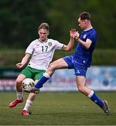 24 April 2025; Jack Sweeney of Republic of Ireland is tackled by Patrick McGowran of England during the Centenary Shield match between Republic of Ireland and England at Athlone Town Stadium in Lissywollen, Westmeath. Photo by Ben McShane/Sportsfile