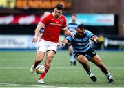 25 April 2025; Tom Farrell of Munster and Liam Belcher of Cardiff go for the ball during the United Rugby Championship match between Cardiff and Munster at Cardiff Arms Park in Cardiff, Wales. Photo by Chris Fairweather/Sportsfile