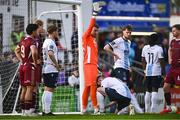 25 April 2025; Ryan Brennan of Drogheda United ties the laces of his goalkeeper Luke Dennison during the SSE Airtricity Men's Premier Division match between Galway United v Drogheda United at Eamonn Deacy Park in Galway. Photo by Piaras Ó Mídheach/Sportsfile