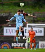 25 April 2025; Mason Melia of St Patrick's Athletic in action against Sean Grehan of Bohemians during the SSE Airtricity Men's Premier Division match between Bohemians and St Patrick's Athletic at Dalymount Park in Dublin. Photo by Seb Daly/Sportsfile