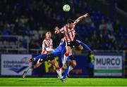 25 April 2025; Adam O'Reilly of Derry City in action against James Olayinka of Waterford during the SSE Airtricity Men's Premier Division match between Waterford and Derry City at the Regional Sports Centre in Waterford. Photo by Tyler Miller/Sportsfile