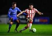 25 April 2025; Adam O'Reilly of Derry City in action against Conan Noonan of Waterford during the SSE Airtricity Men's Premier Division match between Waterford and Derry City at the Regional Sports Centre in Waterford. Photo by Tyler Miller/Sportsfile