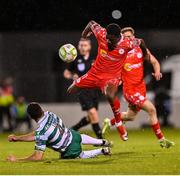 25 April 2025; Mipo Odubeko of Shelbourne is tackled by Roberto Lopes of Shamrock Rovers during the SSE Airtricity Men's Premier Division match between Shamrock Rovers and Shelbourne at Tallaght Stadium in Dublin. Photo by Ramsey Cardy/Sportsfile