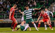 25 April 2025; Evan Caffrey of Shelbourne in action against Josh Honohan, below, and Dylan Watts of Shamrock Rovers during the SSE Airtricity Men's Premier Division match between Shamrock Rovers and Shelbourne at Tallaght Stadium in Dublin. Photo by Ramsey Cardy/Sportsfile