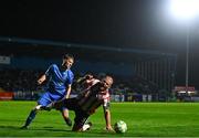25 April 2025; Mark Connolly of Derry City is fouled by Kyle White of Waterford during the SSE Airtricity Men's Premier Division match between Waterford and Derry City at the Regional Sports Centre in Waterford. Photo by Tyler Miller/Sportsfile