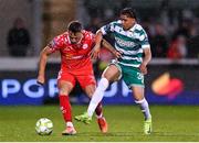25 April 2025; John O'Sullivan of Shelbourne in action against Victor Ozhianvuna of Shamrock Rovers during the SSE Airtricity Men's Premier Division match between Shamrock Rovers and Shelbourne at Tallaght Stadium in Dublin. Photo by Ramsey Cardy/Sportsfile