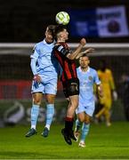 25 April 2025; James McManus of Bohemians in action against Barry Baggley of St Patrick's Athletic during the SSE Airtricity Men's Premier Division match between Bohemians and St Patrick's Athletic at Dalymount Park in Dublin. Photo by Seb Daly/Sportsfile
