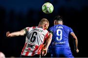25 April 2025; Mark Connolly of Derry City in action against Padraig Amond of Waterford during the SSE Airtricity Men's Premier Division match between Waterford and Derry City at the Regional Sports Centre in Waterford. Photo by Tyler Miller/Sportsfile