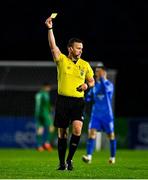 25 April 2025; Referee Paul Norton shows a yellow card to Adam O'Reilly of Derry City during the SSE Airtricity Men's Premier Division match between Waterford and Derry City at the Regional Sports Centre in Waterford. Photo by Tyler Miller/Sportsfile