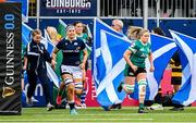 26 April 2025; Edel McMaho of Ireland and Rachel Malcom of Scotland run out onto the pitch before the Women's Six Nations Rugby Championship match between Scotland and Ireland at Hive Stadium in Edinburgh, Scotland. Photo by Paul Devlin/Sportsfile