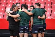 26 April 2025; Connacht scrum and contact coach Colm Tucker talks to his front row players before the United Rugby Championship match between Emirates Lions and Connacht at Emirates Airline Park in Johannesburg, South Africa. Photo by Shaun Roy/Sportsfile