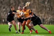 26 April 2025; Abbie Timmons of Ashbourne is tackled by Monica Bannon, right, and Sophie Kiernan Molloy of Longford during the Cusack Plate Final match between Longford and Ashbourne during the Leinster Rugby Girls Finals Day at Mullingar RFC in Mullingar, Westmeath. Photo by Ben McShane/Sportsfile