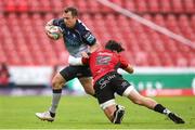 26 April 2025; Jack Carty of Connacht is tackled by Bronson Mills of Emirates Lions during the United Rugby Championship match between Emirates Lions and Connacht at Emirates Airline Park in Johannesburg, South Africa. Photo by Shaun Roy/Sportsfile