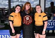 26 April 2025; Ashbourne captains Keela Walsh Fagherazzi, left, and Laura Scuffil are presented the Cusack Plate by Carol Cusack, mother of Paul, after the Cusack Plate Final match between Longford and Ashbourne during the Leinster Rugby Girls Finals Day at Mullingar RFC in Mullingar, Westmeath. Photo by Ben McShane/Sportsfile