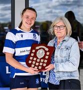 26 April 2025; Athy captain Niamh Goggin is presented the Flood Plate by Emma Flood after in the Flood Plate Final match between Athy and UCD during the Leinster Rugby Girls Finals Day at Mullingar RFC in Mullingar, Westmeath. Photo by Ben McShane/Sportsfile