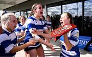 26 April 2025; Athy captain Niamh Goggin celebrates with her teammates and the Plate after the Flood Plate Final match between Athy and UCD during the Leinster Rugby Girls Finals Day at Mullingar RFC in Mullingar, Westmeath. Photo by Ben McShane/Sportsfile