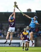26 April 2025; Brian Hayes of Dublin in action against Charlie McGuckin of Wexford during the Leinster GAA Hurling Senior Championship Round 2 match between Dublin and Wexford at Parnell Park in Dublin. Photo by David Fitzgerald/Sportsfile