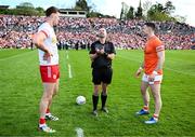 26 April 2025; Referee David Gough with Tyrone captain Brian Kennedy, left, and Armagh captain Aidan Forker before the Ulster GAA Football Senior Championship semi-final match between Armagh and Tyrone at St Tiernach's Park in Clones, Monaghan. Photo by Seb Daly/Sportsfile
