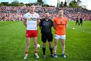 26 April 2025; Referee David Gough with Tyrone captain Brian Kennedy, left, and Armagh captain Aidan Forker before the Ulster GAA Football Senior Championship semi-final match between Armagh and Tyrone at St Tiernach's Park in Clones, Monaghan. Photo by Seb Daly/Sportsfile