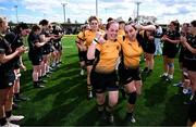 26 April 2025; Ashbourne players celebrate as Longford players perform a guard of honour after the Cusack Plate Final match between Longford and Ashbourne during the Leinster Rugby Girls Finals Day at Mullingar RFC in Mullingar, Westmeath. Photo by Ben McShane/Sportsfile
