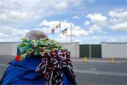 26 April 2025; Ribbons in the colours of both Offaly and Galway rest on the shoulders of a flag seller before the Leinster GAA Hurling Senior Championship Round 2 match between Offaly and Galway at Glenisk O’Connor Park in Tullamore, Offaly. Photo by Ray McManus/Sportsfile