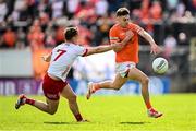 26 April 2025; Darragh McMullan of Armagh in action against Kieran McGeary of Tyrone during the Ulster GAA Football Senior Championship semi-final match between Armagh and Tyrone at St Tiernach's Park in Clones, Monaghan. Photo by Seb Daly/Sportsfile