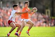 26 April 2025; Darragh McMullan of Armagh in action against Michael McKernan of Tyrone during the Ulster GAA Football Senior Championship semi-final match between Armagh and Tyrone at St Tiernach's Park in Clones, Monaghan. Photo by Seb Daly/Sportsfile