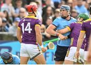 26 April 2025; John Hetherton of Dublin and Lee Chin of Wexford during the Leinster GAA Hurling Senior Championship Round 2 match between Dublin and Wexford at Parnell Park in Dublin. Photo by David Fitzgerald/Sportsfile