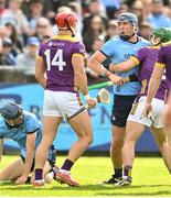 26 April 2025; John Hetherton of Dublin and Lee Chin of Wexford during the Leinster GAA Hurling Senior Championship Round 2 match between Dublin and Wexford at Parnell Park in Dublin. Photo by David Fitzgerald/Sportsfile