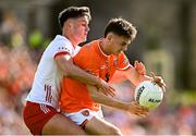 26 April 2025; Darragh McMullan of Armagh in action against Michael McKernan of Tyrone during the Ulster GAA Football Senior Championship semi-final match between Armagh and Tyrone at St Tiernach's Park in Clones, Monaghan. Photo by Seb Daly/Sportsfile