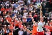 26 April 2025; Brian Kennedy of Tyrone and Ben Crealey of Armagh contest a high ball during the Ulster GAA Football Senior Championship semi-final match between Armagh and Tyrone at St Tiernach's Park in Clones, Monaghan. Photo by Seb Daly/Sportsfile