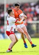 26 April 2025; Rory Grugan of Armagh in action against Niall Devlin of Tyrone during the Ulster GAA Football Senior Championship semi-final match between Armagh and Tyrone at St Tiernach's Park in Clones, Monaghan. Photo by Seb Daly/Sportsfile