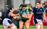 26 April 2025; Vicky Elmes Kinlan of Ireland, centre, is tackled by Leah Bartlett, left, and Ellianne Clarke of Scotland during the Women's Six Nations Rugby Championship match between Scotland and Ireland at Hive Stadium in Edinburgh, Scotland. Photo by Paul Devlin/Sportsfile