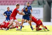 26 April 2025; Liam Turner of Leinster is tackled by Taine Plumtree and Joe Roberts of Scarlets during the United Rugby Championship match between Scarlets and Leinster at Parc Y Scarlets in Swansea, Wales. Photo by Chris Fairweather/Sportsfile