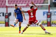 26 April 2025; Ross Byrne of Leinster chips the ball past Vaea Fifita of Scarlets during the United Rugby Championship match between Scarlets and Leinster at Parc Y Scarlets in Swansea, Wales. Photo by Chris Fairweather/Sportsfile