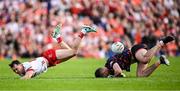 26 April 2025; Armagh goalkeeper Ethan Rafferty collides with Darragh Canavan of Tyrone during the Ulster GAA Football Senior Championship semi-final match between Armagh and Tyrone at St Tiernach's Park in Clones, Monaghan. Photo by Seb Daly/Sportsfile