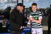 26 April 2025; Greystones captain Emma Costello is presented the Cusack Cup by Patrick Cusack after the Cusack Cup Final match between Greystones and Edenderry during the Leinster Rugby Girls Finals Day at Mullingar RFC in Mullingar, Westmeath. Photo by Ben McShane/Sportsfile