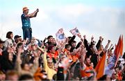 26 April 2025; Armagh supporters celebrate during the Ulster GAA Football Senior Championship semi-final match between Armagh and Tyrone at St Tiernach's Park in Clones, Monaghan. Photo by Seb Daly/Sportsfile