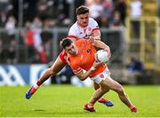 26 April 2025; Ross McQuillan of Armagh in action against Michael McKernan of Tyrone during the Ulster GAA Football Senior Championship semi-final match between Armagh and Tyrone at St Tiernach's Park in Clones, Monaghan. Photo by Seb Daly/Sportsfile