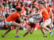 26 April 2025; Cormac Quinn of Tyrone in action against Armagh players Callum O'Neill, left, and Oisin Conaty during the Ulster GAA Football Senior Championship semi-final match between Armagh and Tyrone at St Tiernach's Park in Clones, Monaghan. Photo by Seb Daly/Sportsfile