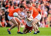 26 April 2025; Cormac Quinn of Tyrone in action against Armagh players Callum O'Neill, left, and Oisin Conaty during the Ulster GAA Football Senior Championship semi-final match between Armagh and Tyrone at St Tiernach's Park in Clones, Monaghan. Photo by Seb Daly/Sportsfile