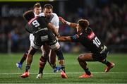 26 April 2025; Stuart McCloskey of Ulster is tackled by Jaden Hendrikse, left, and Jordan Hendrikse of Hollywoodbets Sharks during the United Rugby Championship match between Ulster and Hollywoodbets Sharks at Kingspan Stadium in Belfast. Photo by Tyler Miller/Sportsfile