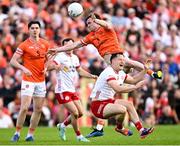 26 April 2025; Ross McQuillan of Armagh and Kieran McGeary of Tyrone collide during the Ulster GAA Football Senior Championship semi-final match between Armagh and Tyrone at St Tiernach's Park in Clones, Monaghan. Photo by Seb Daly/Sportsfile
