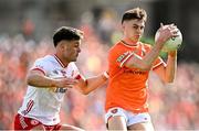 26 April 2025; Darragh McMullan of Armagh in action against Michael McKernan of Tyrone during the Ulster GAA Football Senior Championship semi-final match between Armagh and Tyrone at St Tiernach's Park in Clones, Monaghan. Photo by Seb Daly/Sportsfile