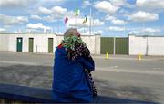 26 April 2025; Ribbons in the colours of both Offaly and Galway rest on the shoulders of a flag seller before the Leinster GAA Hurling Senior Championship Round 2 match between Offaly and Galway at Glenisk O’Connor Park in Tullamore, Offaly. Photo by Ray McManus/Sportsfile