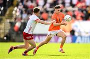 26 April 2025; Darragh McMullan of Armagh in action against Kieran McGeary of Tyrone during the Ulster GAA Football Senior Championship semi-final match between Armagh and Tyrone at St Tiernach's Park in Clones, Monaghan. Photo by Seb Daly/Sportsfile