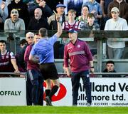 26 April 2025; Referee James Owens issues a yellow card to Galway manager Micheál Donoghue before the start of the second half during the Leinster GAA Hurling Senior Championship Round 2 match between Offaly and Galway at Glenisk O’Connor Park in Tullamore, Offaly. Photo by Ray McManus/Sportsfile