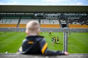 27 April 2025; A young boy looks on at match taking place on the pitch ahead of the Leinster GAA Football Senior Championship semi-final match between Kildare and Louth at Glenisk O'Connor Park in Tullamore, Offaly. Photo by Shauna Clinton/Sportsfile