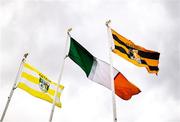 27 April 2025; Flags, from left, the Antrim flag, the Irish tricolour, and the Kilkenny flag are seen before the Leinster GAA Hurling Senior Championship Round 2 match between Antrim and Kilkenny at Corrigan Park in Belfast. Photo by Thomas Flinkow/Sportsfile
