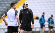 27 April 2025; Clare hurlers Aron Shanagher, right, and John Conlon walk the pitch before the Munster GAA Hurling Senior Championship Round 2 match between Waterford and Clare at Walsh Park in Waterford. Photo by Piaras Ó Mídheach/Sportsfile
